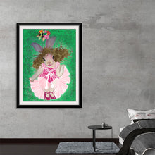  “Ava Under The Mistletoe” by Ava Leopold: Step into a world where whimsy and enchantment intertwine. This captivating artwork invites you to explore a lush green backdrop, where a delightful character—complete with bunny ears—dances with joy. The intricate details of the pink dress and the expressive eyes evoke a sense of wonder.
