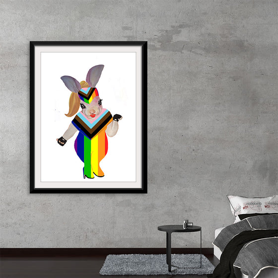 Immerse yourself in the vibrant and whimsical world of Ava Leopold’s “Ava World Pride.” This exquisite print captures a playful yet powerful image of a character adorned in rainbow colors, embodying the spirit of unity, diversity, and freedom. 