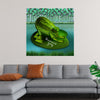 “Downward Frog” by Carrie Webster invites you into a mystical world where nature and art intertwine. This captivating print portrays a majestic frog in a serene yoga pose atop a lily pad. The intricate details of the frog’s textured skin come alive in vibrant shades of green, while the water below reflects reeds and grasses. 