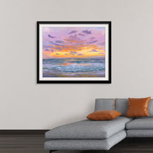  “Serene” by Cielo Alegre: Immerse yourself in the tranquil beauty of this exquisite print. Capturing the ethereal dance of sunset hues reflecting upon gentle ocean waves, every brushstroke weaves a narrative of calm and harmony. The soft, muted tones create a tranquil atmosphere, making it a perfect addition to any space seeking a touch of nature-inspired elegance. 