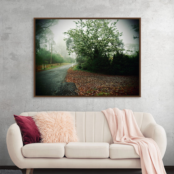 “Autumn Mist” by Julie Elliot invites you to step into a tranquil morning shrouded in mist. In this captivating print, the artist captures the essence of an autumn day where fog delicately kisses the lush greenery and a quiet road. Each dew-kissed leaf and soft haze is rendered with exquisite precision, evoking a sense of peace and solitude. 