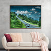 “Highway to Nowhere” by Julie Elliot is a mesmerizing artwork that captures the essence of an enigmatic journey. The lush greenery, the winding road, and the serene sky evoke a sense of mystery and adventure. 