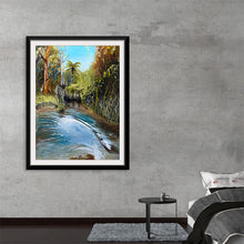  Immerse yourself in the serene beauty of nature with this exquisite print of an original artwork. The piece captures a tranquil scene where the gentle flow of a river is surrounded by lush greenery and towering trees, basking in the golden embrace of sunlight. Every brushstroke brings to life the intricate details of the foliage and the mesmerizing dance of light on water, inviting a sense of calm and connection to the natural world into your space.