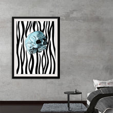  “Tiger Pattern” by Marta Tesoro is a mesmerizing fusion of the wild and the ethereal. In this captivating artwork, the bold, contrasting beauty of zebra stripes intertwines with haunting elegance—a skillfully rendered skull at its heart. Each stripe pulsates with life, encasing the spectral skull in a dance of existence and extinction. 