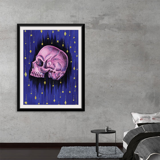 “Starry Night” by Marta Tesoro is a captivating artwork that seamlessly blends the macabre and the mystical. This exquisite print, encased in a sleek black frame, features a meticulously detailed skull rendered in haunting shades of purple, set against a cosmic backdrop of twinkling stars and cascading comets. Every brushstroke invites you into a universe where mortality and eternity converge, offering an enigmatic piece that is as thought-provoking as it is visually stunning. 