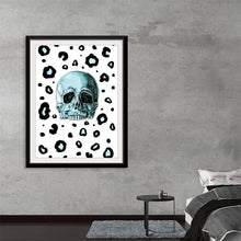  “Leopard Print” by Marta Tesoro is a captivating masterpiece that seamlessly blends the edgy allure of a meticulously detailed skull with the untamed elegance of leopard spots. Every print captures the intricate lines and shadows, promising a visual spectacle that transforms any space into an enclave of mystery and artistry. 