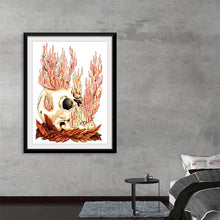  This captivating artwork, now available as a premium print, is a masterful blend of macabre and beauty. It features a hauntingly serene human skull nestled amidst autumn leaves, crowned by an ethereal growth of coral-like structures. Every intricate detail is meticulously rendered to breathe life and mystery into this piece. It’s a perfect conversation starter that will add an element of the mystical to any space. 