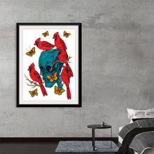  This artwork is a captivating dance of life and death, masterfully captured in a print. At the heart of the piece is a hauntingly beautiful turquoise skull, brought to life by vibrant red cardinals and golden butterflies. The intricate details of the wing patterns and the branches emerging from the skull create a mystical aura that draws the viewer in. 