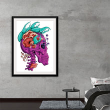  “Beetles” by Marta Tesoro: Dive into a world where art and imagination converge. Encased in a sleek black frame, this exquisite print features a mesmerizing fusion of a vibrant purple skull adorned with an intricate ensemble of flora and fauna. Every brushstroke reveals Tesoro’s masterful artistry, weaving together the ethereal beauty of blooming flowers and the enigmatic allure of beetles. 
