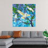 "Larrikins" by Melissa Read-Devine is a vibrant and playful depiction of three cockatoos perched on a blossoming tree. The birds' white feathers contrast beautifully against the lush green foliage and the bright blue sky, creating a sense of joy and energy. Read-Devine's loose brushwork and expressive use of color bring these lively creatures to life, making this print a perfect addition to any home or office.