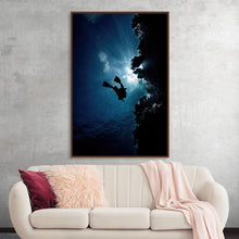  “Underwater Animals – Diver Blue Ocean 2” by Victor Hawk invites you to plunge into the mystical depths of the ocean. This exquisite print captures the serene yet exhilarating moment of a diver, suspended in the tranquil embrace of the deep blue sea, surrounded by the enigmatic silhouettes of underwater flora. The ethereal beams of light piercing through the water’s surface illuminate the diver, casting an otherworldly glow that accentuates the artwork’s mystical allure. 