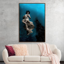  Step into a world of tranquility with this enchanting print. The artwork captures a figure suspended in a serene underwater scene, creating a sense of peaceful weightlessness. The flowing dress contrasts beautifully with the stillness of the water, adding a dreamlike quality that draws viewers in.