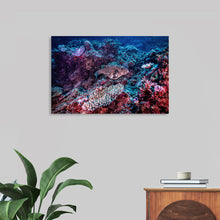  Dive into the vibrant underwater world with this stunning print. The artwork features a speckled fish gliding gracefully over a bed of richly colored coral, teeming with marine life. The intricate textures and hues of the coral create a stunning contrast against the deep blue of the ocean, making this image a testament to the beauty of aquatic ecosystems and an artistic marvel. 