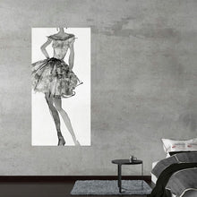  “Fashion Sketchbook V” by Anne Tavoletti invites you into a world of haute couture and artistic elegance. This exquisite print captures the essence of style—a beautifully detailed sketch of a sophisticated dress seems to dance on the canvas. The monochromatic tones blend seamlessly, creating a timeless piece that exudes both modernity and classic charm. 
