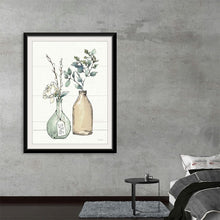  “Modern Farmhouse III Crop” by Anne Tavoletti: Immerse yourself in the serene beauty of this exquisite print. Created by artist Anne Tavoletti, it effortlessly marries rustic charm with contemporary elegance. Delicate foliage housed in vintage glass bottles comes to life with meticulous detail and soft, inviting colors. The harmonious blend of modern sophistication and rustic allure makes it a perfect addition to your home or office.