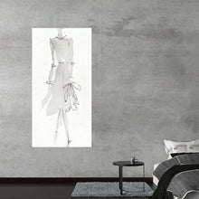  “La Fashion I Gray” by Anne Tavoletti is a captivating piece that seamlessly blends the elegance of fashion design with the raw beauty of sketch artistry. The artwork, rendered in graceful strokes, captures a dress form adorned with a chic ensemble, evoking an air of sophistication and avant-garde style. 
