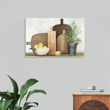  “Rustic Kitchen Brown” by Julia Purinton: Immerse yourself in the warm, inviting ambiance of this exquisite print. Capturing the essence of homely warmth and culinary creativity, the artwork features meticulously painted still life elements. Wooden cutting boards lean against the wall, their grainy textures inviting touch. 