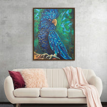  "Peacockatoo" by Rachel Braybon is a captivating acrylic painting that showcases the vibrant beauty of a Red-tailed Black Cockatoo. The bird's iridescent plumage, shimmering with shades of blue, black, and gold, is rendered with incredible detail. Its piercing eyes and distinctive crest add to its regal appearance. Set against a lush green backdrop, this artwork brings a touch of the exotic to any space.