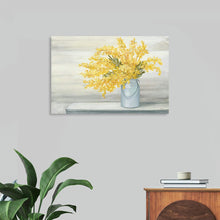  “Golden Fall Cuttings” by Julia Purinton invites you into a world where autumn’s golden hues dance gracefully. This captivating print captures the essence of fall—a bouquet of sun-kissed yellow foliage elegantly arranged in a timeless white vase. Against a muted backdrop, the leaves come alive, each brushstroke meticulously conveying texture and depth. 