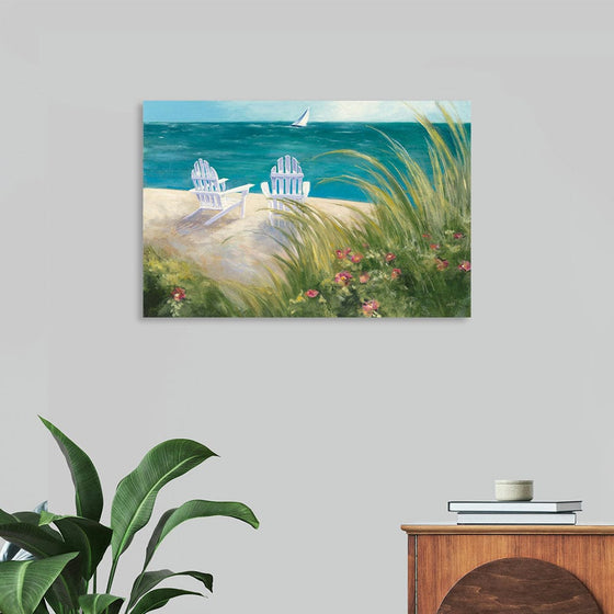 “Regatta I” by Julia Purinton: Immerse yourself in the serene beauty of this exquisite print. Capturing a tranquil coastal scene, where two Adirondack chairs invite you to bask in the golden sands and gaze upon the azure waters. A lone sailboat graces the horizon, embodying the spirit of freedom and adventure. 