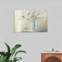  Immerse yourself in the serene beauty of “Cotton Bouquet Crop” by Julia Purinton. Every brushstroke captures the delicate elegance of a flower, bringing nature’s untouched beauty into your living space. The symphony of colors seamlessly blending into one another encapsulates the cotton blossoms’ ethereal presence against a textured backdrop. 