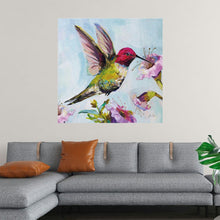  “Hummingbird I Florals” by Jeanette Vertentes invites you into a world where the majestic presence of a vibrant hummingbird takes flight amidst blossoming flowers. Each brushstroke breathes life into this mesmerizing scene, where nature’s colors blend harmoniously under the soft gaze of daylight. The hummingbird, with its wings spread wide, is a symphony of vibrant hues—a red head, a yellow body, and green wings—hovering near blooming purple flowers with delicate green stems and leaves. 