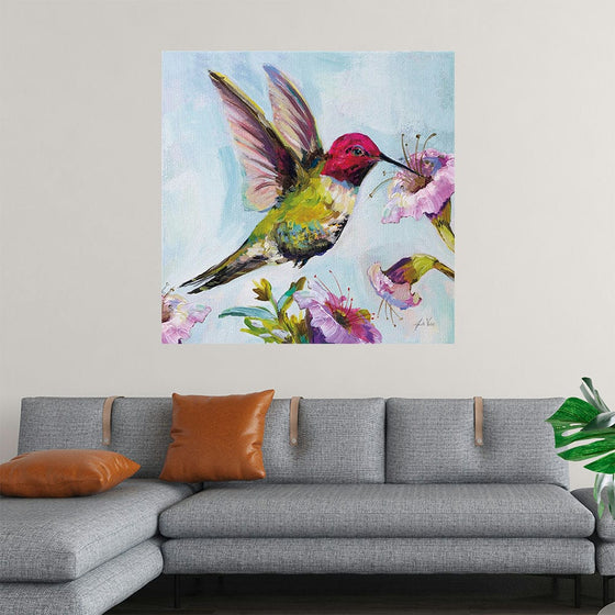 “Hummingbird I Florals” by Jeanette Vertentes invites you into a world where the majestic presence of a vibrant hummingbird takes flight amidst blossoming flowers. Each brushstroke breathes life into this mesmerizing scene, where nature’s colors blend harmoniously under the soft gaze of daylight. The hummingbird, with its wings spread wide, is a symphony of vibrant hues—a red head, a yellow body, and green wings—hovering near blooming purple flowers with delicate green stems and leaves. 