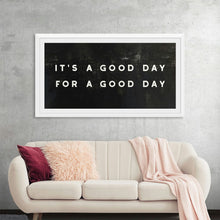  Lovely Home II Panel by Wild Apple is a captivating typography piece that celebrates the simple joys of everyday life. The bold white text, "It's a good day for a good day," is set against a textured black background, creating a striking and thought-provoking image. This minimalist design is perfect for adding a touch of inspiration and positivity to any space.