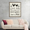 Adorn your space with a touch of rustic charm showcased in this exquisite artwork now available as a print. The artwork, imbued with a vintage flair, features the heartwarming phrase “LOVE YOU a BUSHEL and a Peck” elegantly scripted amidst the classic backdrop. Two silhouetted roosters, surrounded by delicate laurel wreaths, stand as sentinels of enduring affection above the tender inscription. 