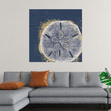  This mesmerizing print features a meticulously detailed sand dollar, the symbol of transformation and impermanence, at its heart. The sand dollar, rendered in subtle white and grey tones, is surrounded by a radiant aura of golden splatter, symbolizing the vibrant energy of life. Set against a deep, textured blue backdrop that mirrors the profound mysteries of the ocean, this artwork is a true conversation starter.