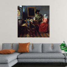  Elevate your space with the timeless elegance of Johannes Vermeer’s “The Glass of Wine” (c. 1658-1660). This exquisite print captures a serene moment of courtship, featuring a seated woman and a standing man in a richly detailed interior. Vermeer’s masterful use of light and shadow, combined with his meticulous attention to detail, brings a sense of intimacy and refinement to the scene. 