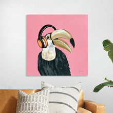  “Wild I Sq” by Yvette St. Amant: Dive into the vibrant and whimsical world of Yvette St. Amant with “Wild I Sq,” a captivating artwork that marries the natural with the contemporary. This exquisite print captures a majestic toucan, adorned with vibrant headphones, offering a playful yet elegant touch to any space. The bold pink backdrop accentuates the bird’s striking features, creating a visual spectacle that is both charming and modern.