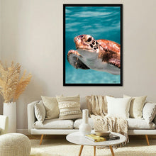  “Ocean Serenity: Beneath the Waves” invites you to plunge into the tranquil depths of the underwater realm. This captivating print captures the essence of a majestic sea turtle as it glides gracefully through cerulean waters. The intricate details of its scales and the depth in its eyes evoke wonder and reverence.